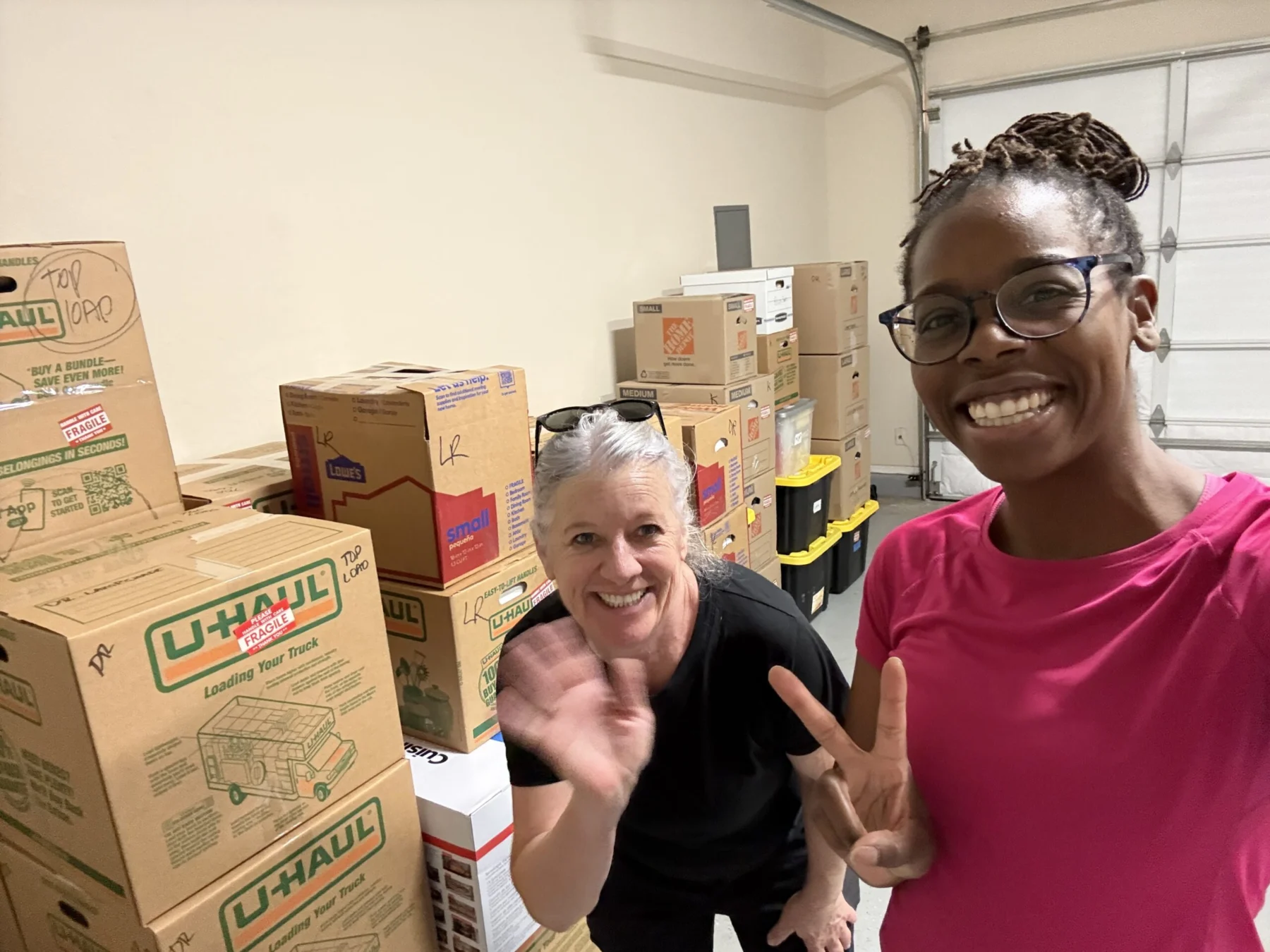 Hadiyah and a team member on a moving project