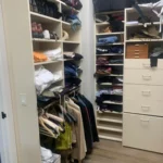Walk-in closet with built-in drawers and shelves