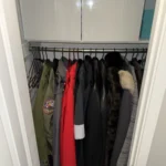 Coat closet with jackets hung by color