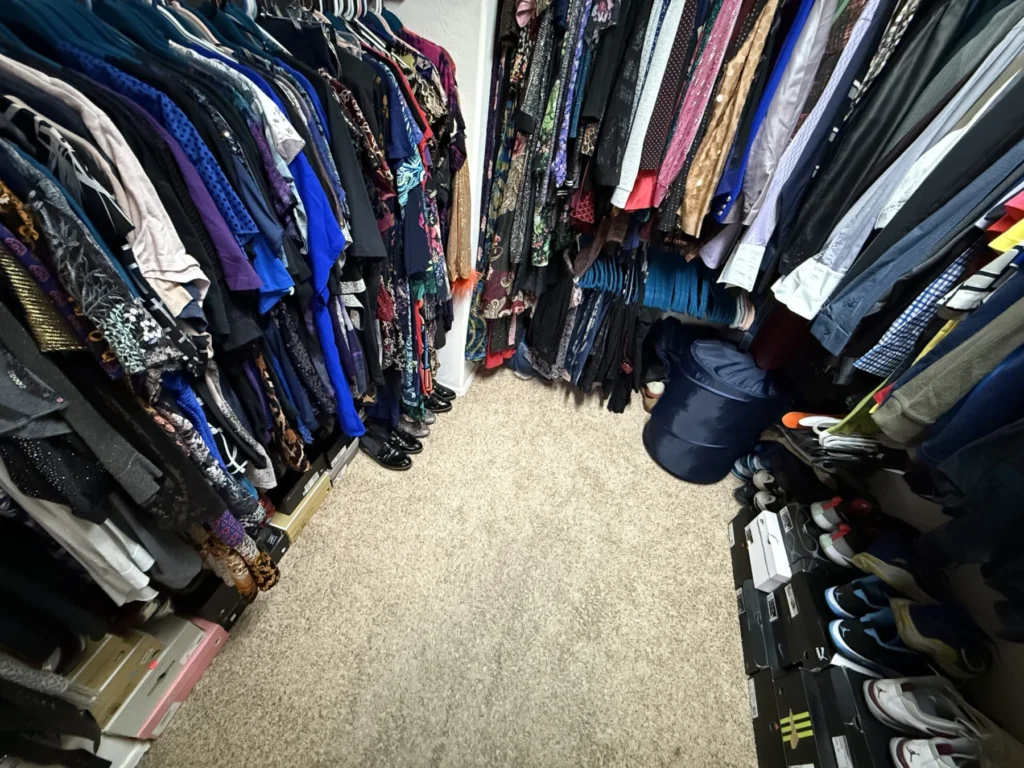 Crowded walk-in closet before organizing