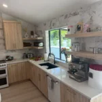 Bright modern kitchen with open shelves and clear counters