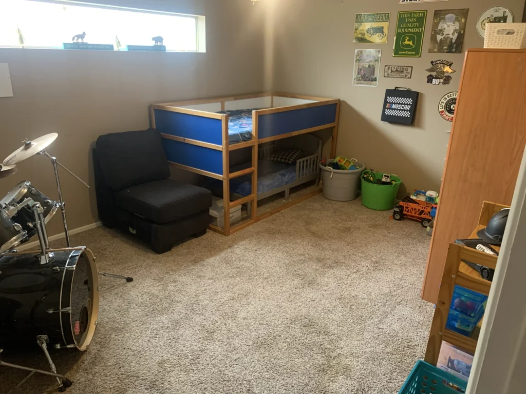 Bonus room with a drum set, bunk bed, and cleared floor