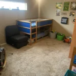 Bonus room with a drum set, bunk bed, and cleared floor