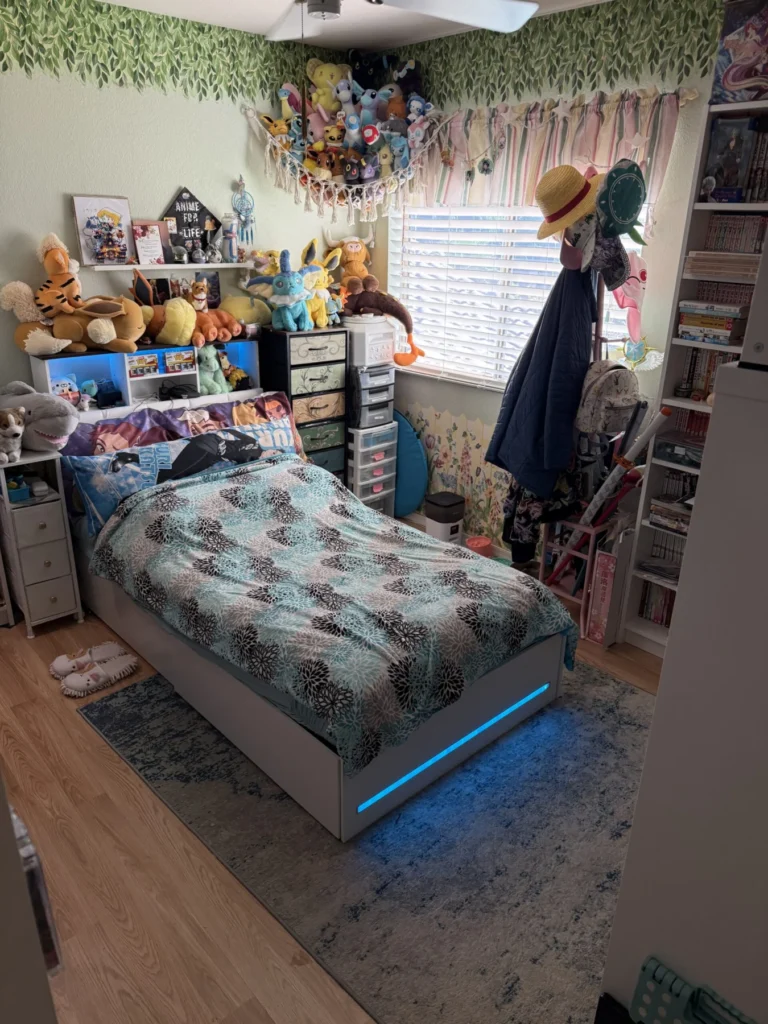 Child’s bedroom after organizing, with the bed cleared and shelves tidied