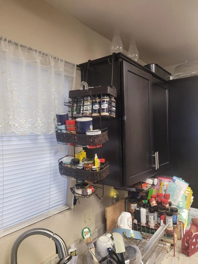 Kitchen corner before organizing, with items stacked on the counter