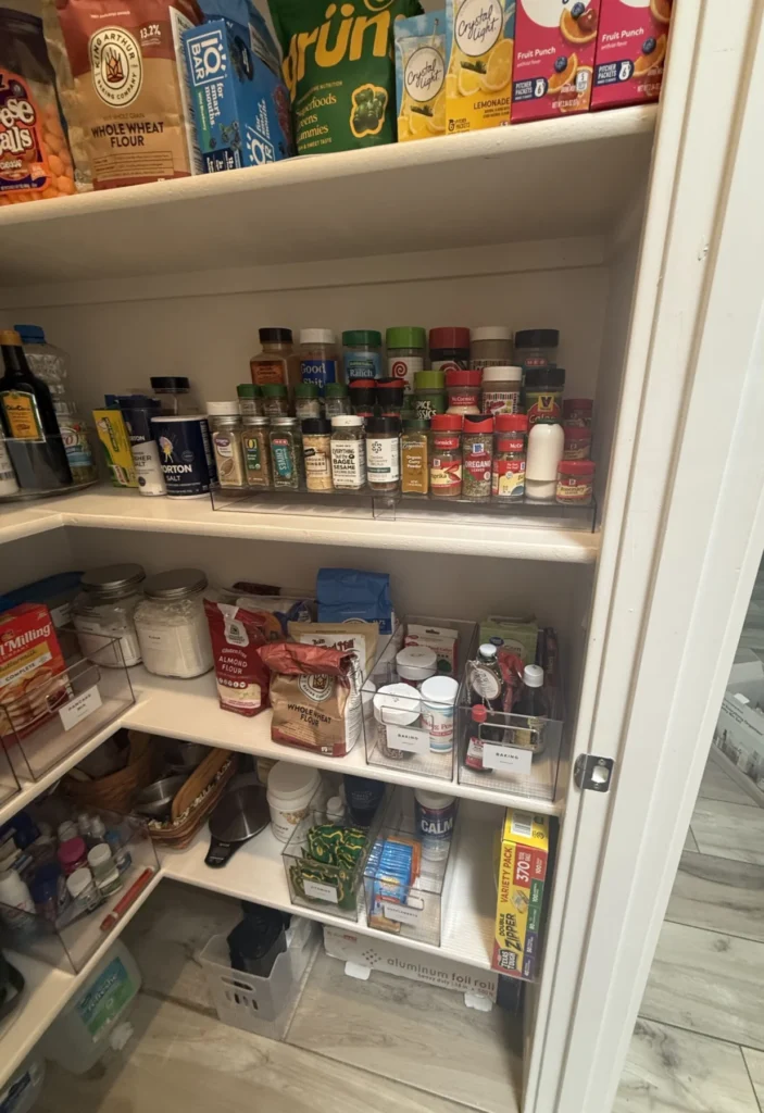 Pantry corner shelves with snacks and spices grouped together