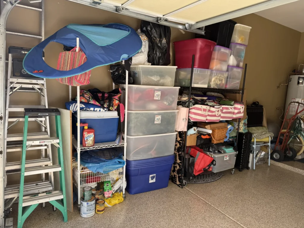 Garage storage rack with labeled plastic bins and a stepladder