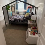 Child’s bedroom with a house-frame bed