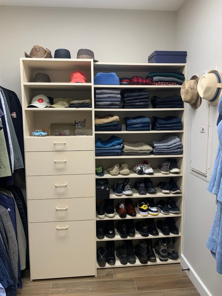 Organized walk-in closet with shelves and drawers