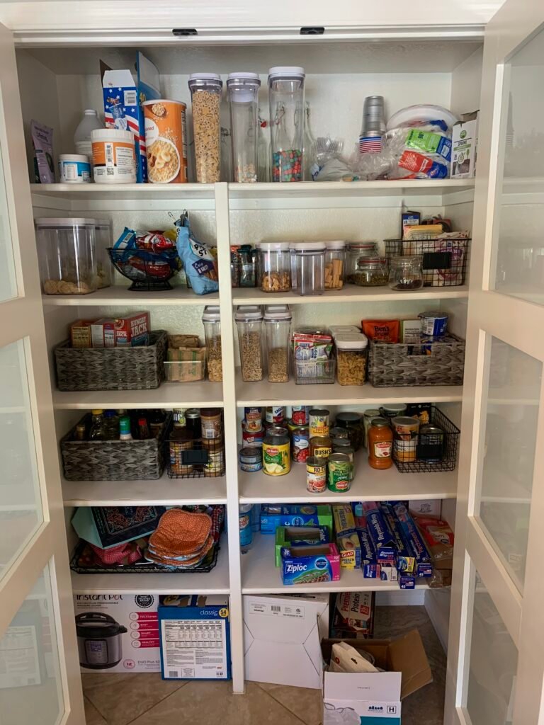 Organized pantry with labeled bins by Neat With Ease